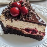 Black Forest Cheesecake, featuring a slice with visible layers of chocolate cookie crust