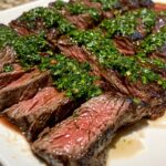 Skirt Steak with Chimichurri, featuring a perfectly seared medium-rare skirt steak sliced into thick