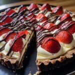 chocolate-covered strawberry tart, featuring a creamy filling and fresh strawberries. The tart is displayed with a slice cut out