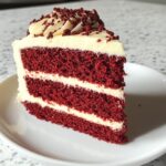 velvety red velvet cake with rich cream cheese frosting and a festive toch